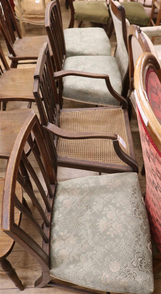 Four George III mahogany dining chairs, one with arms